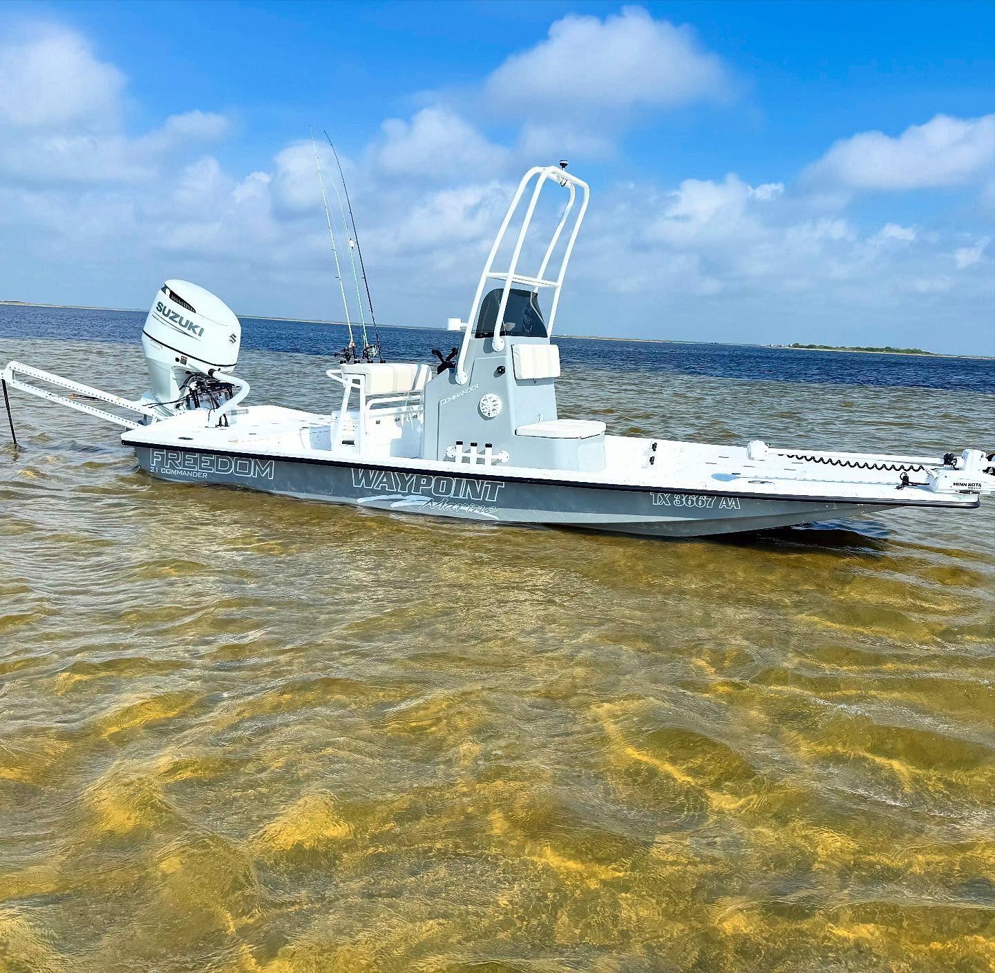Freedom Boats USA 21' Commander 2026 Freedom Boats USA 21' Commander in shallow water, clear sky background.