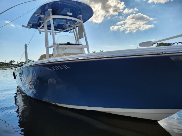 Sportsman Heritage 211 Center Console 2023 Sportsman Heritage 211 Center Console boat on calm water under blue sky.