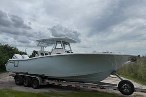 Tidewater 302 CC Adventure 2026 Tidewater 302 CC Adventure boat on trailer under cloudy sky.