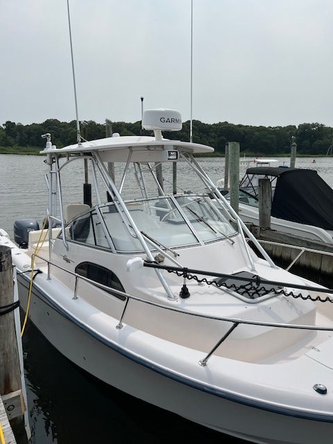 Grady-White Sailfish 282 2004 Grady-White Sailfish 282 boat docked at marina, featuring Garmin equipment.