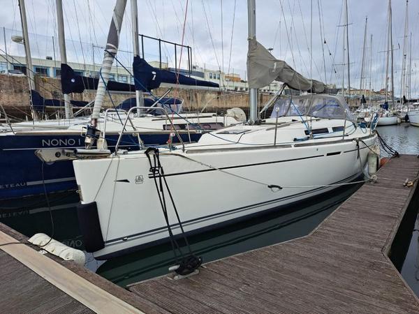 Dufour 34E Performance 2010 Dufour 34E Performance sailboat docked in marina, side view.