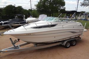 Chaparral Signature 260 2000 Chaparral Signature 260 boat on trailer, parked outdoors.