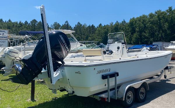 Sundance DX 22 2017 Sundance DX 22 boat on a trailer with a Mercury outboard motor.