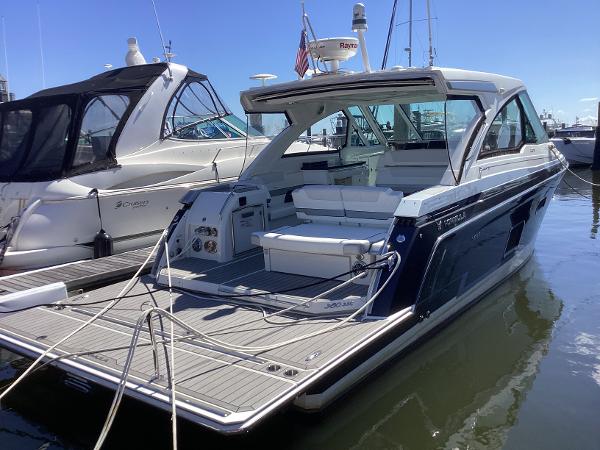 Formula 380 Super Sport Crossover 2020 Formula 380 Super Sport Crossover yacht docked at marina, showcasing sleek design and spacious deck.