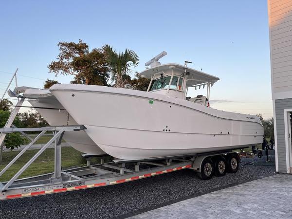World Cat 320 Center Console 2020 World Cat 320CC boat on trailer, parked outdoors.