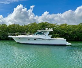 Tiara Yachts 3600 Open 2006 Tiara Yachts 3600 Open cruising on a serene waterway under a blue sky.