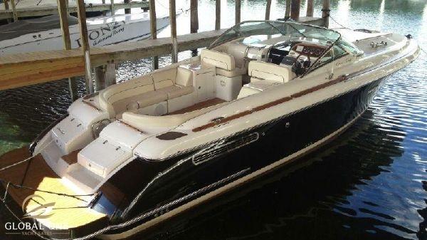 Chris-Craft Corsair 36 2006 Chris-Craft 36 Corsair Heritage boat docked in marina, elegant design and spacious seating.