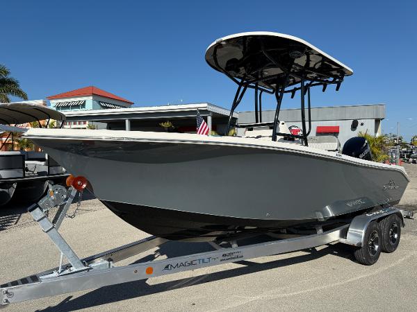 Sea Chaser 22 HFC 2025 Sea Chaser 22 HFC boat on trailer, parked outdoors under clear blue sky.