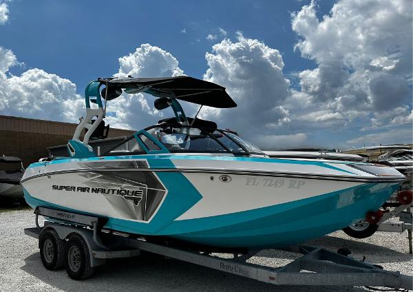 Nautique Super Air G23 2018 Nautique Super Air G23 boat on trailer under cloudy sky.