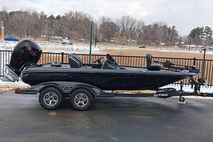 Nitro Z18 2026 Nitro Z18 boat on trailer, black exterior, parked outdoors in winter setting.