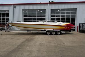 Fountain 35 Lightning 2006 Fountain 35 Lightning speedboat on trailer, parked outside a garage.