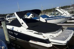 Monterey 298SS Super Sport 2016 Monterey 298SS Super Sport boat docked with black cover, side view.