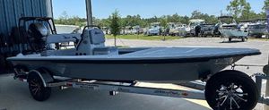 Maverick 18 HPX-V 2024 Maverick 18 HPX-V boat on a trailer in a marina.