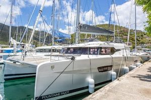 Fountaine Pajot Elba 45 2021 Fountaine Pajot Catamaran Elba 45 docked in a scenic marina.