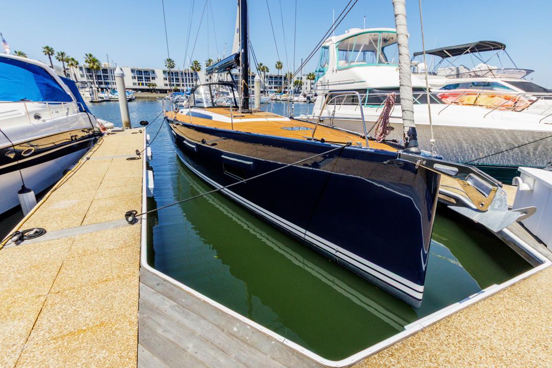 Solaris 50 2017 Solaris 50 yacht docked at marina, surrounded by other boats, under clear blue sky.