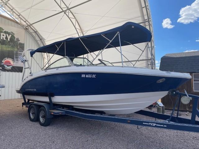 Chaparral Sunesta 264 2008 Chaparral Sunesta 264 boat on trailer under canopy, blue and white design.
