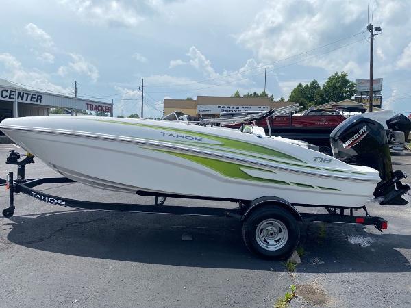 Tahoe T18 2024 Tahoe T18 boat on trailer with green accents and Mercury outboard motor.