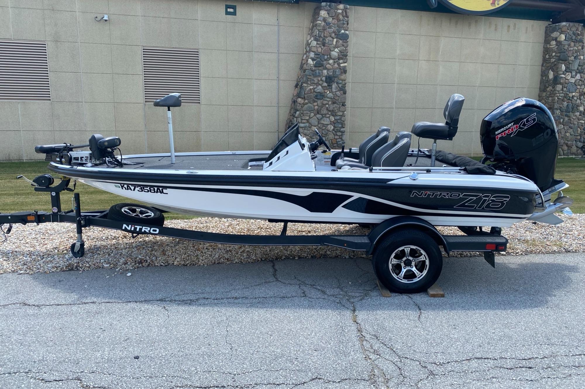 Nitro Z18 Pro 2021 Nitro Z18 Pro fishing boat on trailer, parked outdoors.