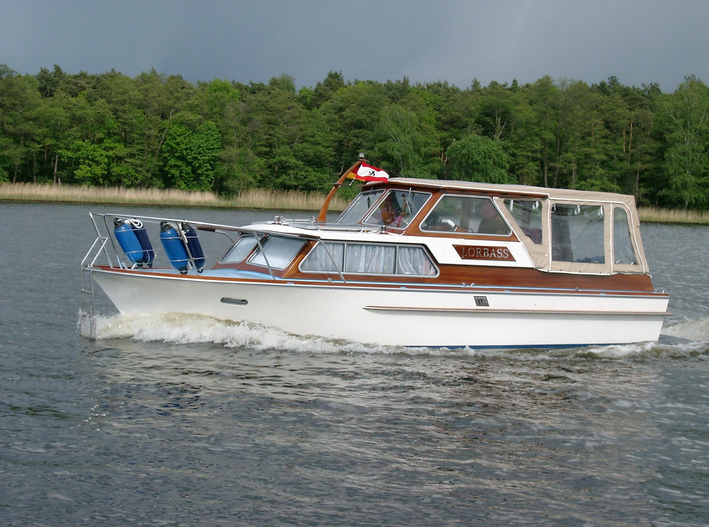 Custom Seestern 1982 Custom Seestern boat cruising on a lake with forested background.