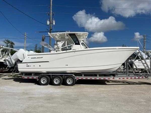 World Cat 280 CC-X 2025 World Cat 280 CC-X boat on trailer under clear blue sky.