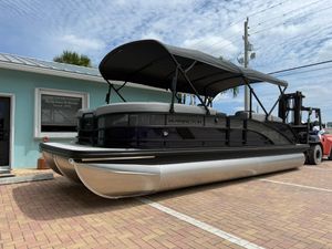 Bennington 24 MSB 2026 Bennington 24 MSB pontoon boat with canopy, parked on brick pavement.