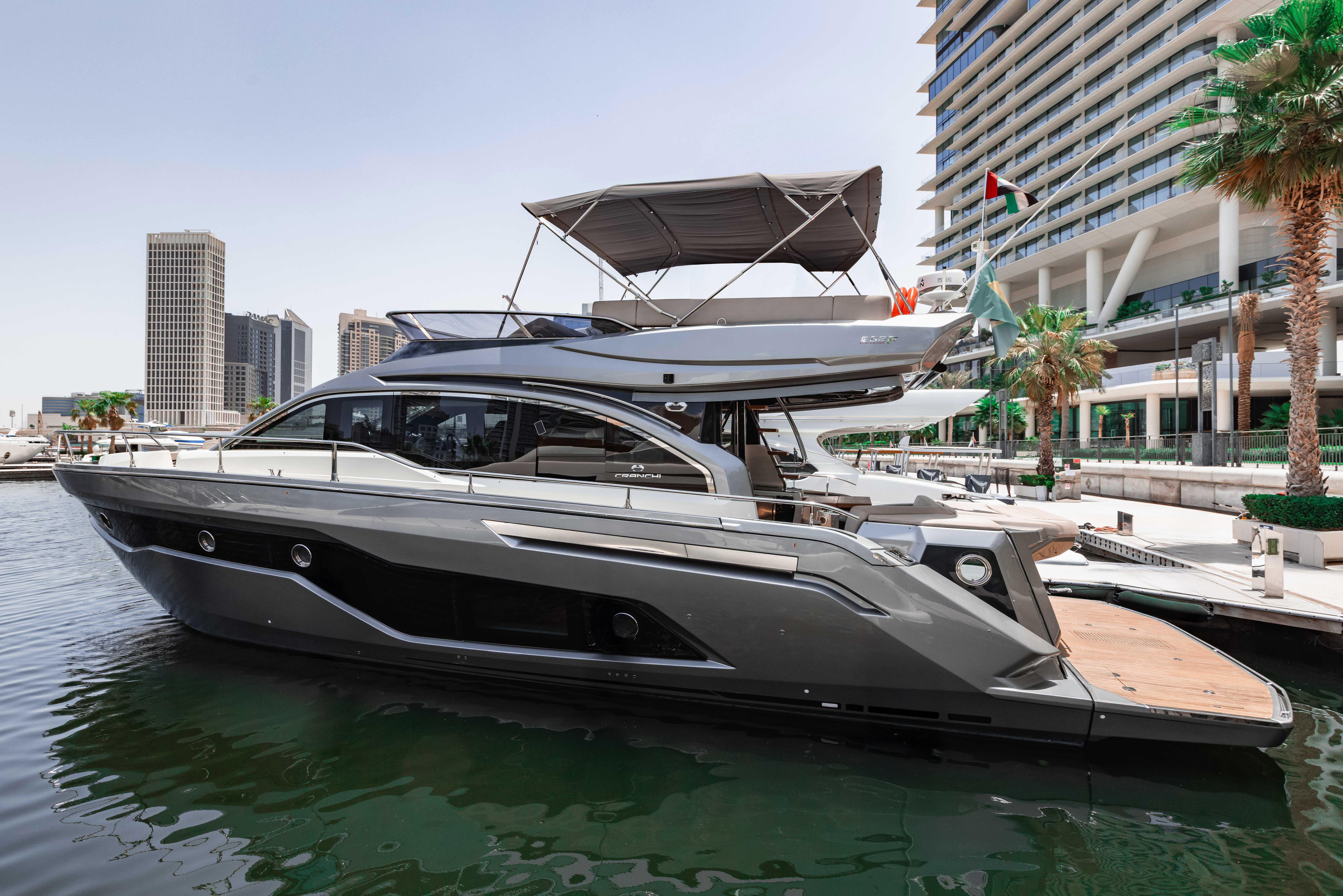 Cranchi E 52F 2019 Cranchi E 52F yacht docked in a modern marina setting.