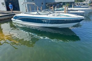 Formula 270 Bowrider 2009 Formula 270 Bowrider boat docked in marina, reflecting on calm water.