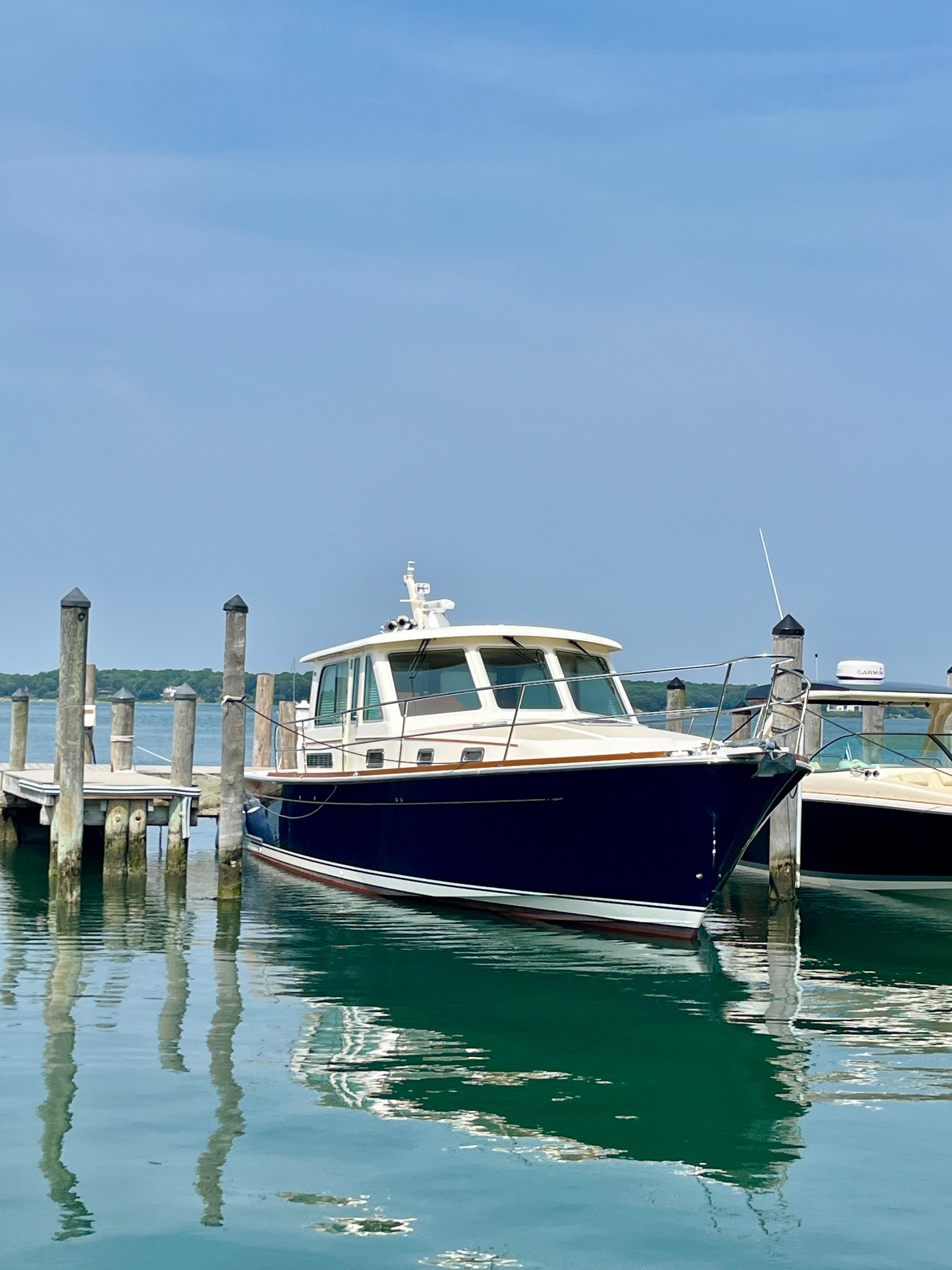 Sabre 40 Sedan 2010 Sabre 40 Sedan yacht docked at a marina on a clear day.