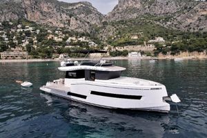 Pardo Yachts E60 Luxury Pardo Yachts E60, 2020 model, anchored in scenic coastal waters with mountainous backdrop.