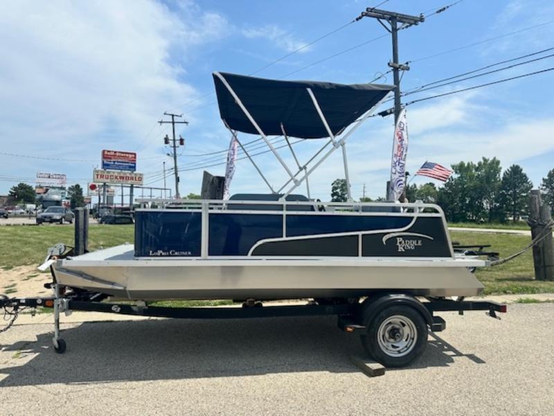 Paddle King Lo Pro Cruiser 2026 Paddle King Lo Pro Cruiser pontoon boat on trailer, parked outdoors.