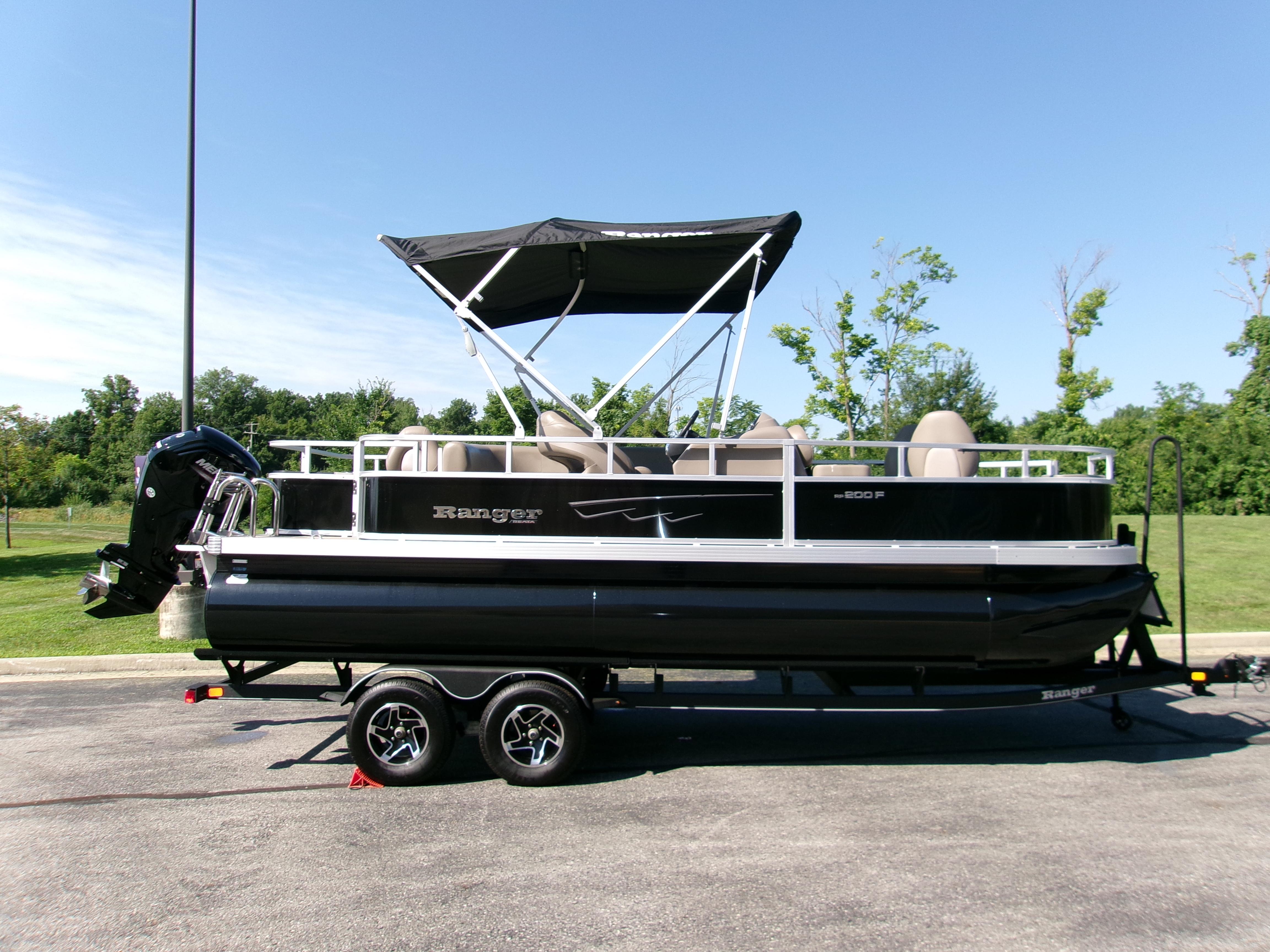 Ranger Reata 200F 2024 Ranger Reata 200F pontoon boat on trailer, parked outdoors.