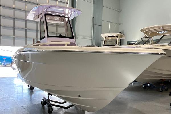 Scout 240 XSF 2025 Scout 240 XSF boat in showroom, sleek design, modern features.