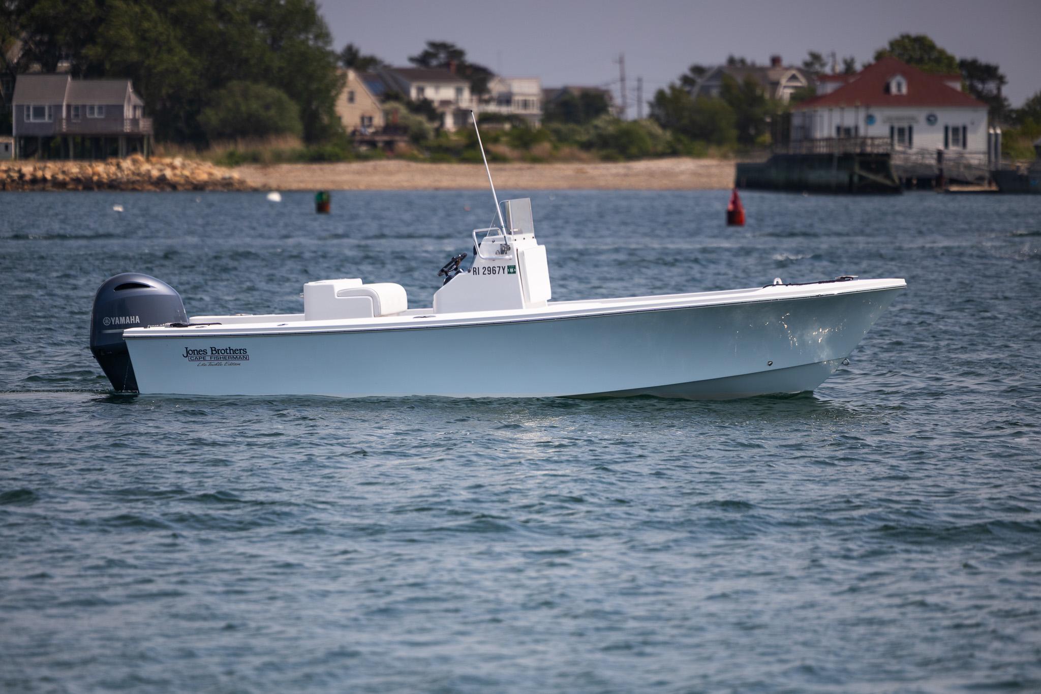 Jones Brothers 23 Cape Fisherman 2023 Jones Brothers 23 Cape Fisherman boat on calm water near shoreline.