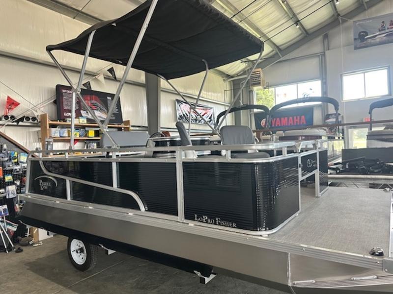 Paddle King LO PRO FISHER 2026 Paddle King LO PRO FISHER pontoon boat in showroom with canopy and seating.