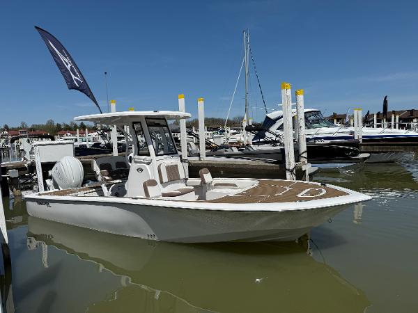 Tidewater 2500 Carolina Bay 2025 Tidewater 2500 Carolina Bay boat docked at marina under clear blue sky.
