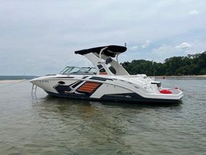 Chaparral Sunesta 264 ProXtreme 2015 Chaparral Sunesta 264 ProXtreme boat on calm water near a forested shoreline.