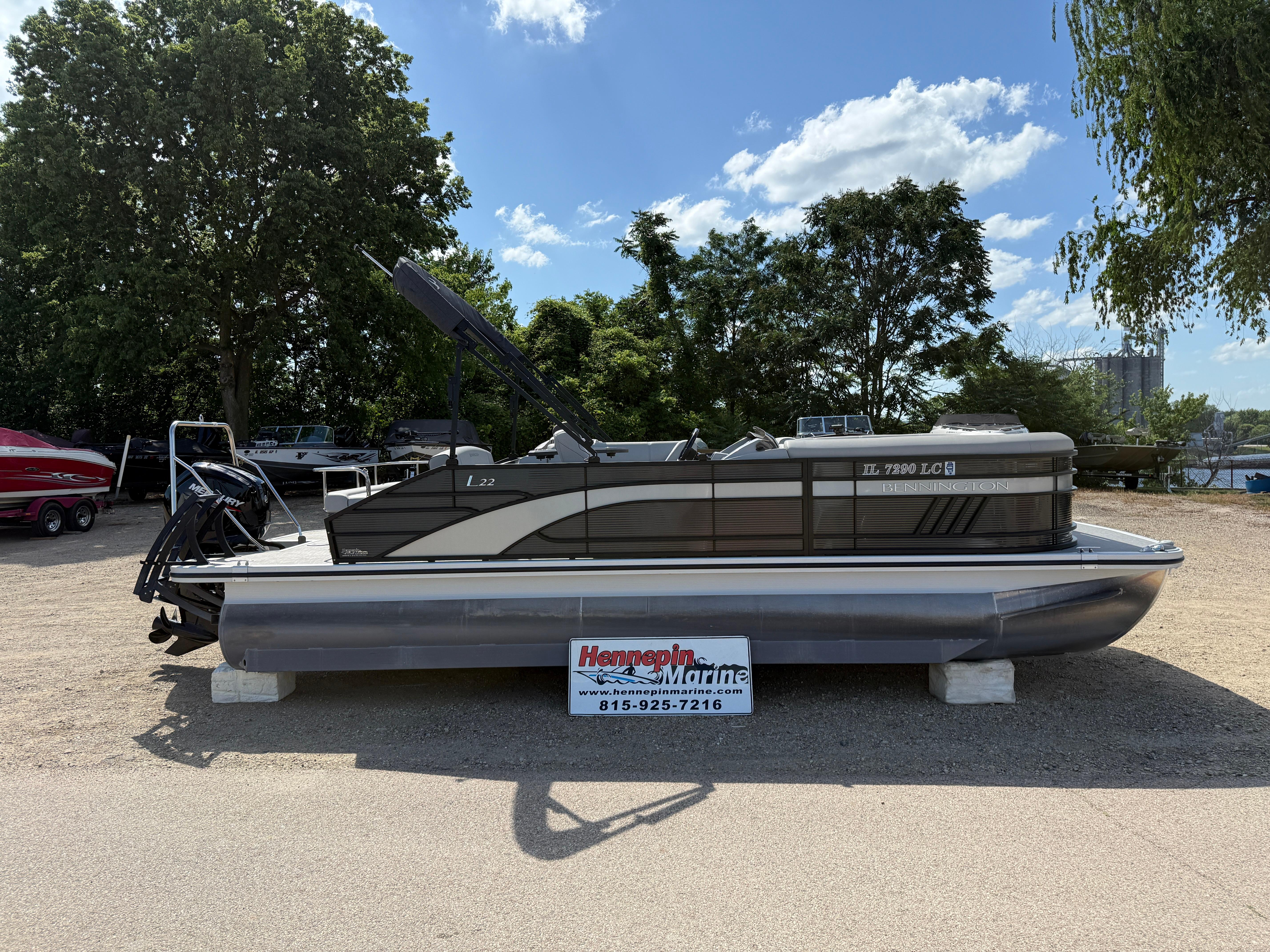 Bennington 22 LSB 2022 Bennington 22 LSB pontoon boat displayed outdoors on a sunny day.