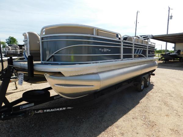 Sun Tracker Party Barge 22 RF DLX 2023 Sun Tracker Party Barge 22 RF DLX pontoon boat on trailer.