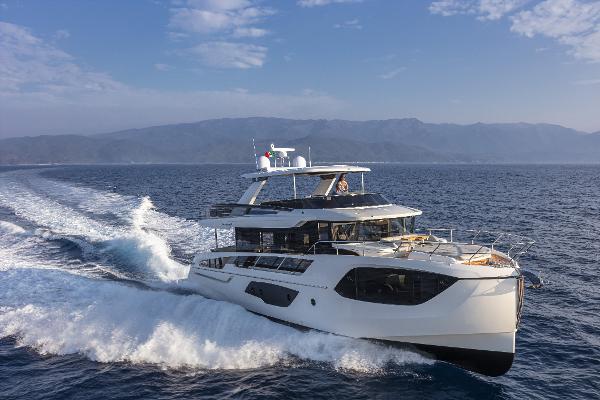 Absolute Navetta 64 2024 Absolute Navetta 64 yacht cruising on open water.