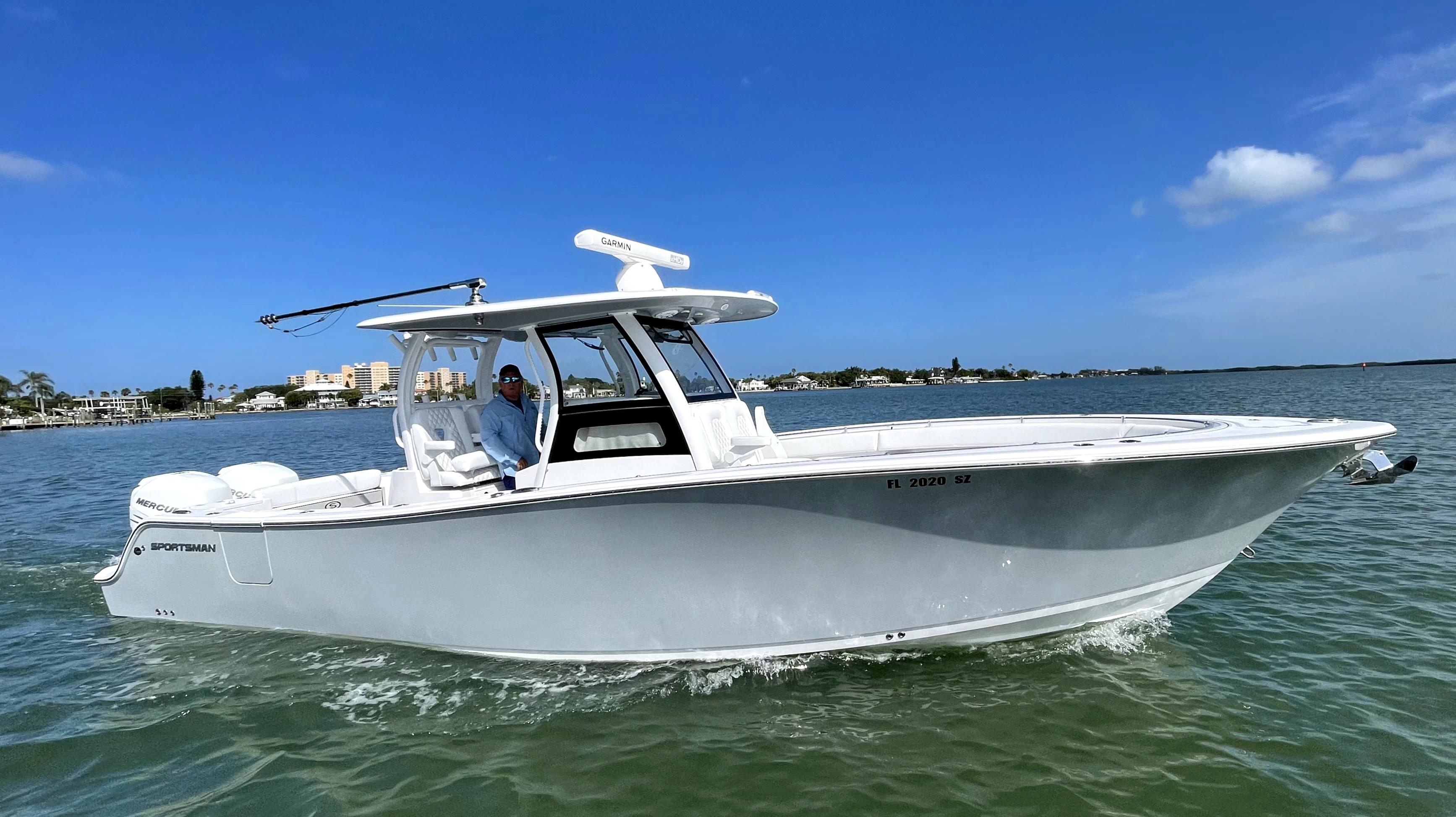 Sportsman Open 322 Center Console 2021 Sportsman Open 322 Center Console boat cruising on a sunny day.