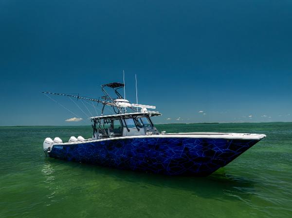 Freeman 42 LR Freeman 42 LR 2021 boat with blue geometric design on calm green water.