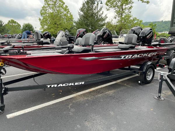 Tracker Panfish 17 2025 Tracker Panfish 17 boat, red color, parked on trailer in outdoor setting.