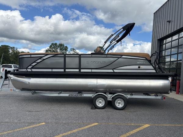 Godfrey Monaco 235 SB 2025 Godfrey Monaco 235 SB pontoon boat on trailer, parked outdoors.