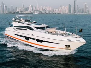 Numarine 105HT Luxurious 2016 Numarine 105HT yacht cruising near a modern city skyline.