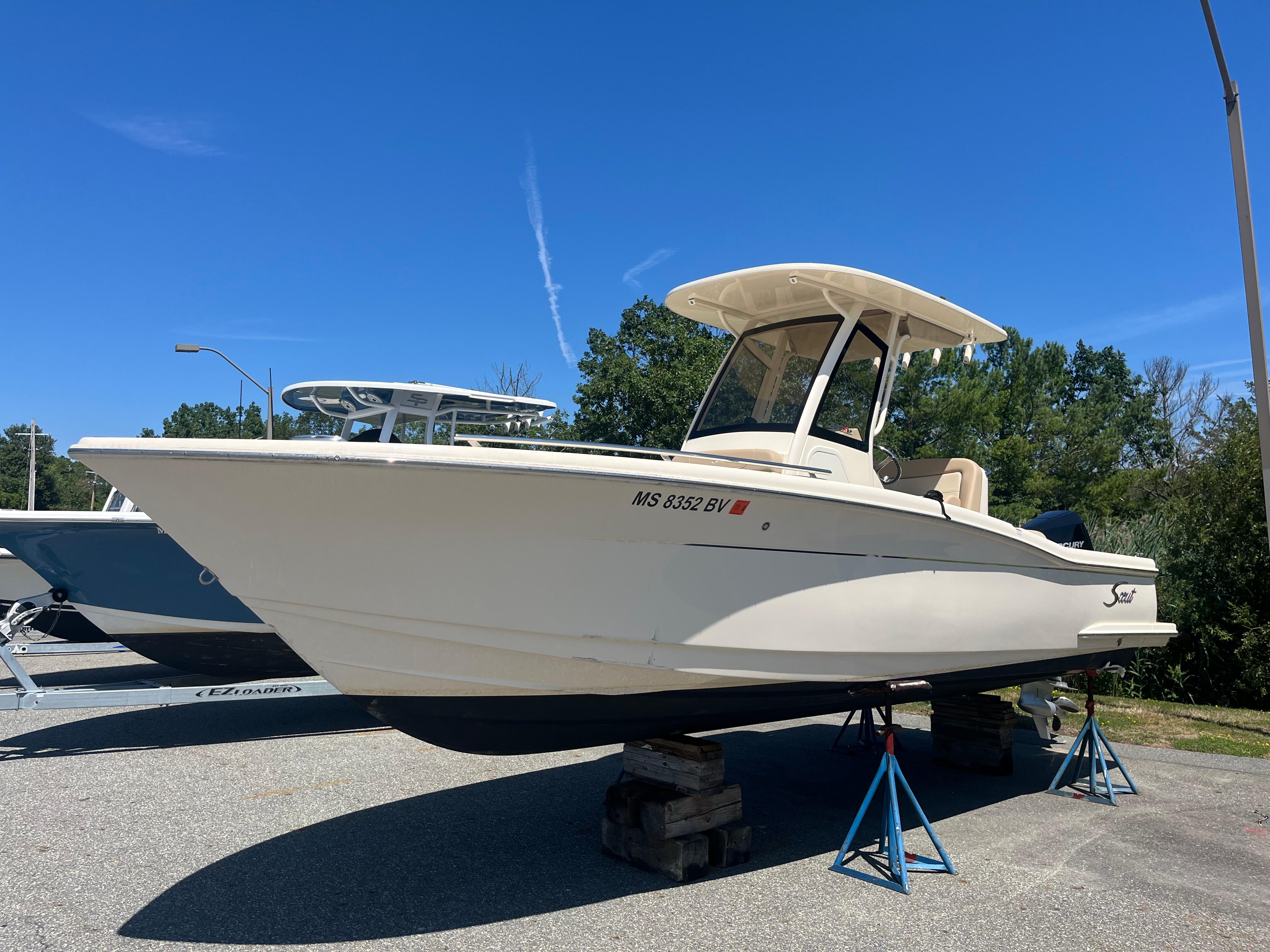 Scout 240 XSF 2024 Scout 240 XSF boat on stands under clear blue sky.