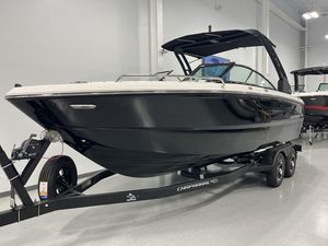 Chaparral 247 SSX 2025 Chaparral 247 SSX boat on trailer in showroom.
