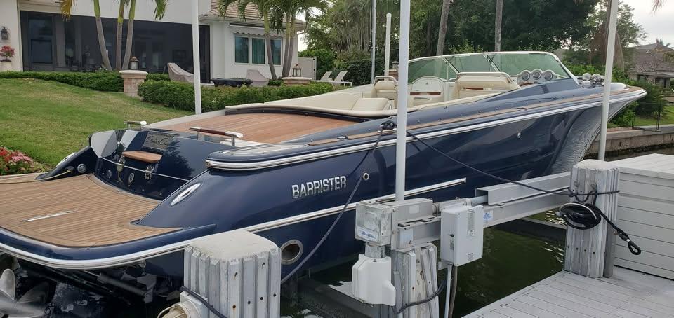 Chris-Craft Corsair 28 2010 Chris-Craft Corsair 28 boat docked, featuring sleek design and wooden deck.