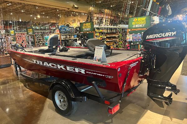 Tracker Panfish 17 2025 Tracker Panfish 17 boat with Mercury engine displayed in a store.