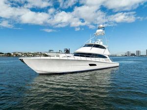 Viking 92 Enclosed Bridge 2017 Viking 92 Enclosed Bridge yacht on open water under blue sky.