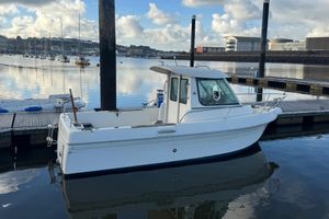 Jeanneau Merry Fisher 605 Jeanneau Merry Fisher 605 boat docked in a marina, 2001 model, calm water.